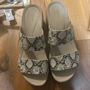 Gently used brown snakeskin crocs